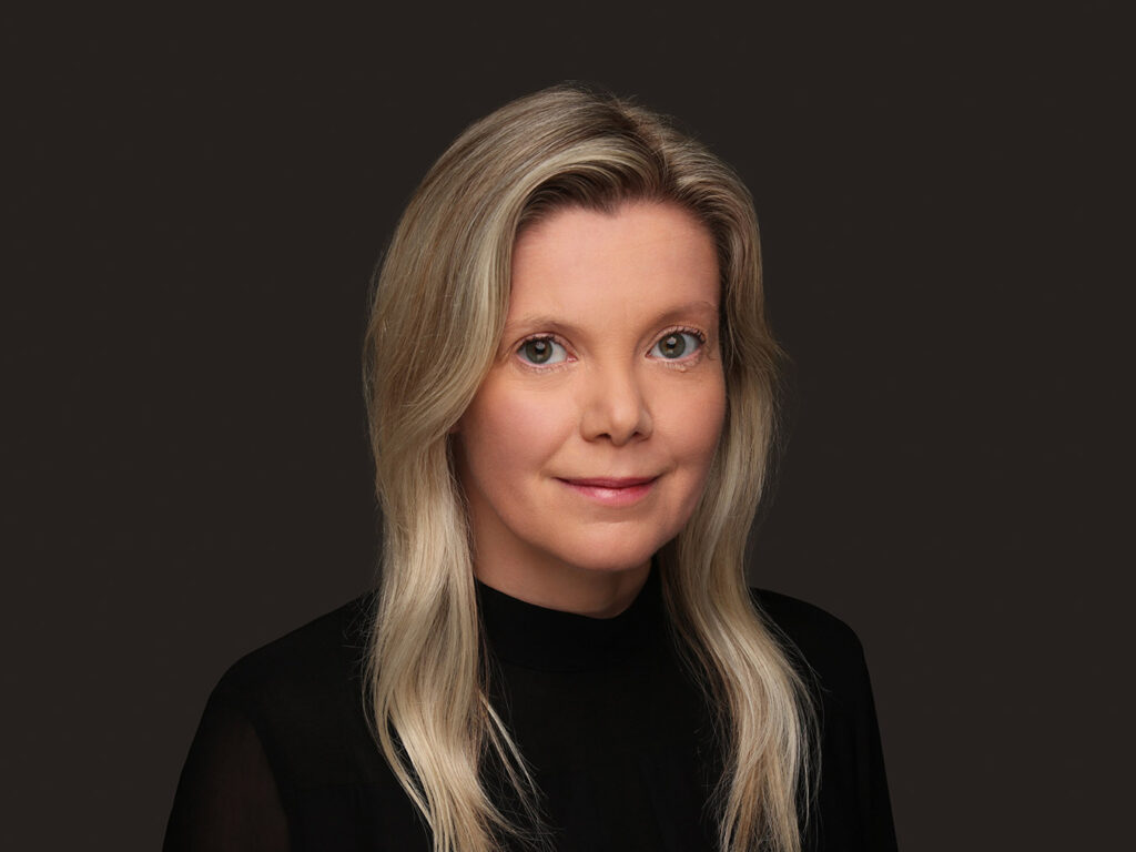 A studio-shot photo of Sarah